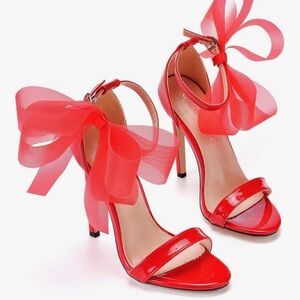 Women’s red high heel sandals ankle straps.